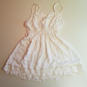 Off white tunic with floral lace.